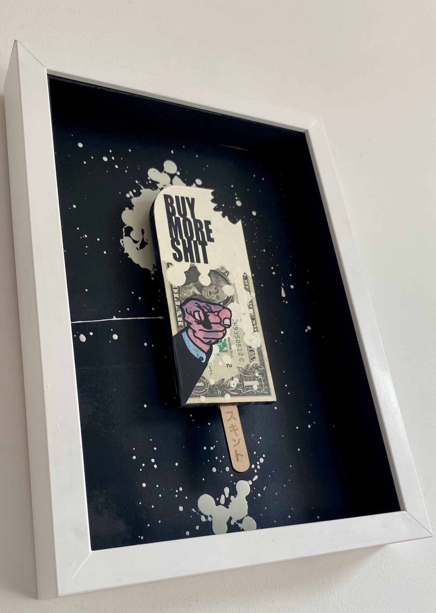 the AXIOMATIC point - Buy More Shit. Finger Pointing White Lolly.